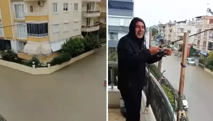 Sokaklar göle döndü ama o balkondan olta attı